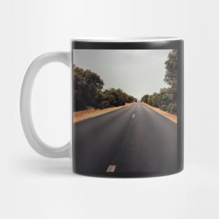 Car Driving Through Olive Tree Forest Mug